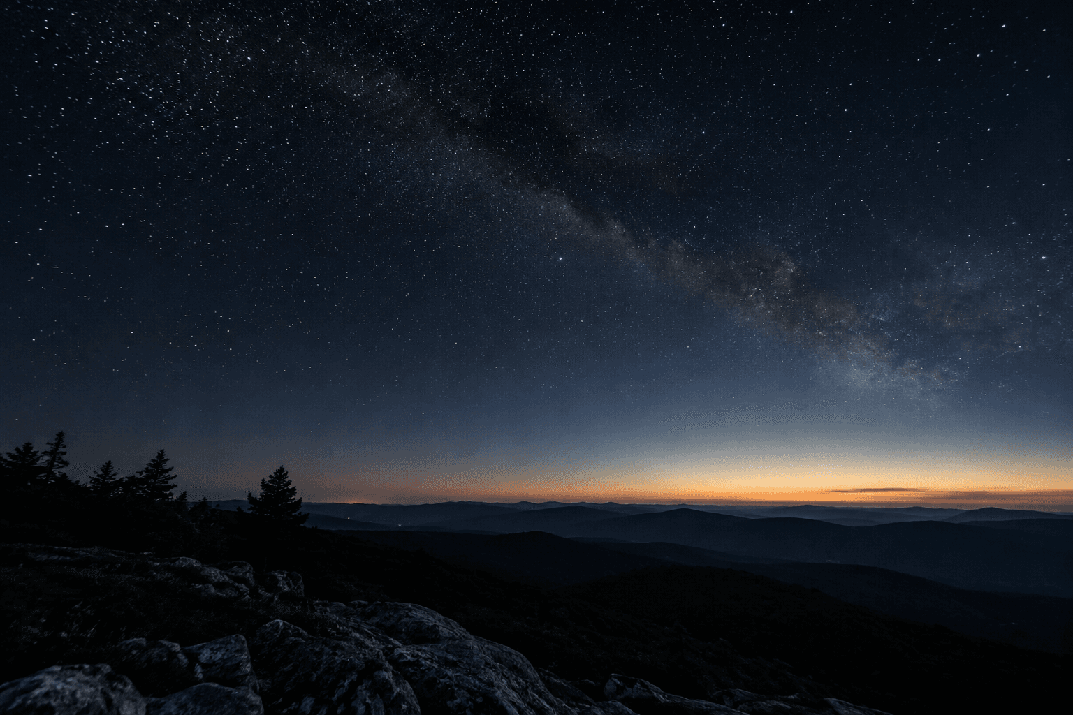 Photographic illustration: stars above dark hills before dawn